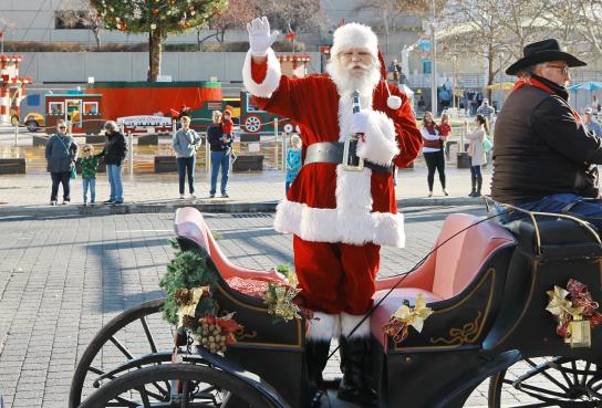 Santa standing in his carriage