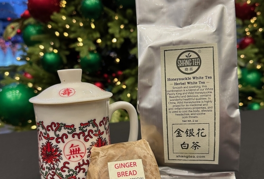 Kung Fu Tea Cup with Floral Design, Small Moon Cake in Paper and Silver Bag of Tea