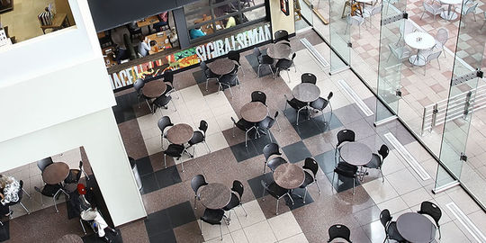 photo looking down on tables and chairs in Crown Center Atrium.