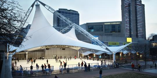 View of Ice Skating Rink with Buildings in Background